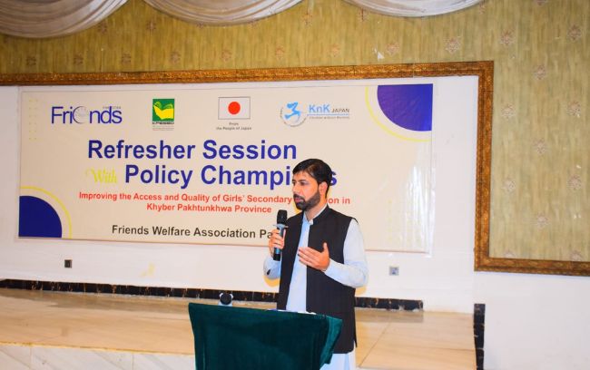 A speaker addressing the Policy Champions refresher session.