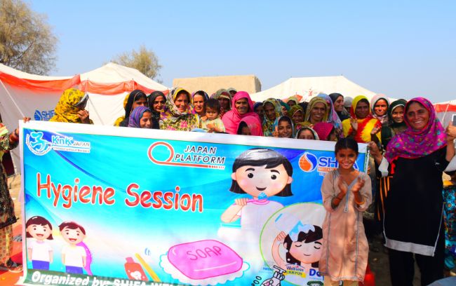 Women and children at a hygiene awareness session.
