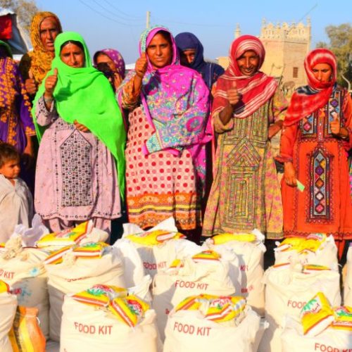 Women collecting food kits from a KnK Japan distribution