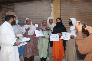 Community members at a COVID-19 awareness session