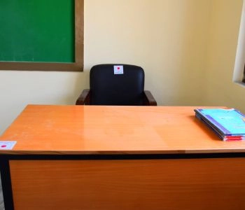 Teacher's desk and chair supplied to a classroom