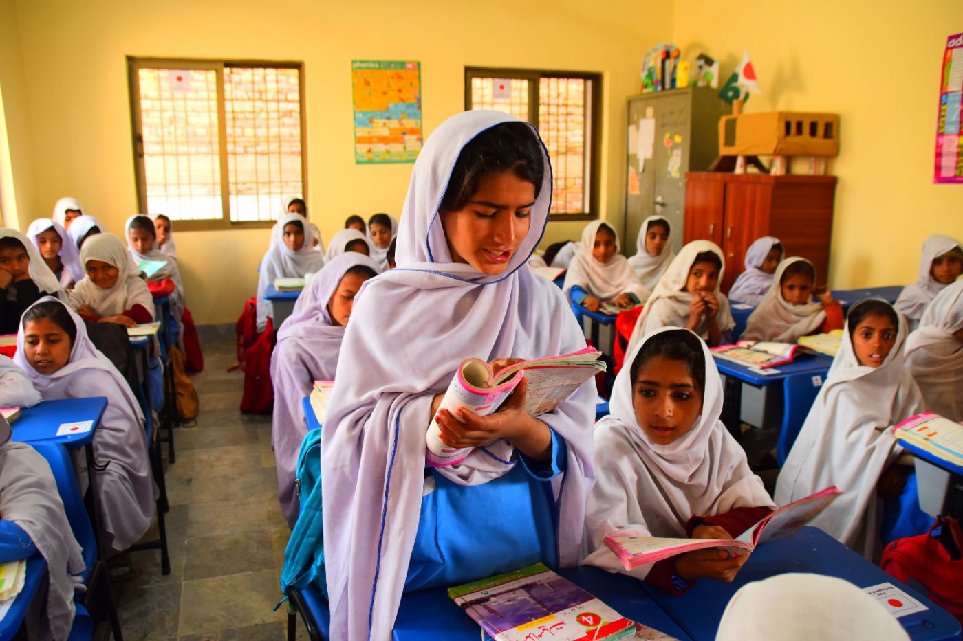 Girls studying inside a newly reconstructed KnK Japan school classroom in Usta Muhammad, Balochistan